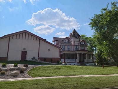 Exterior view of a senior living facility with landscaped gardens