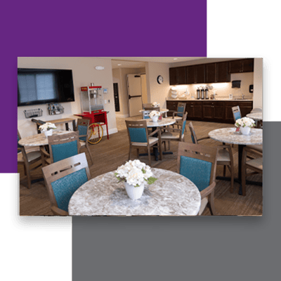 Bright dining area with tables and flowers