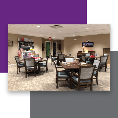 Dining area with tables and chairs set for residents