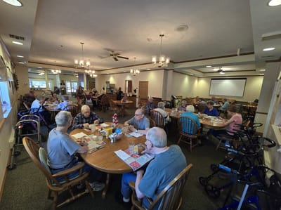 Residents enjoying meals in a cozy dining room
