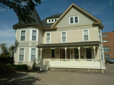 Exterior view of a Victorian-style assisted living facility