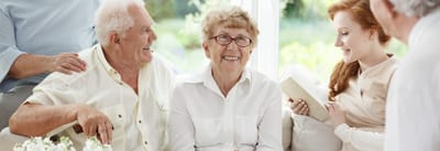 Grand Island Lakeview Care and Rehabilitation Center, nursing home in Grand Island, NE — Seniors enjoying conversation in a bright, inviting lounge