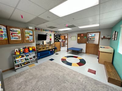 Bright activity room with colorful decorations and furniture