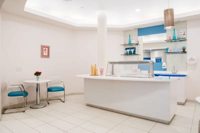 Bright interior of a facility dining area with seating