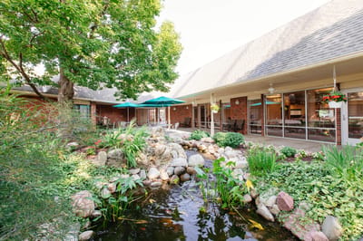 Beautifully landscaped outdoor space with a pond