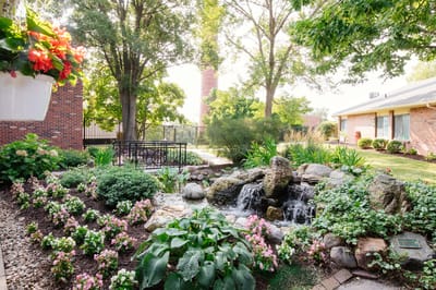 Beautiful garden area with a water feature and flowers