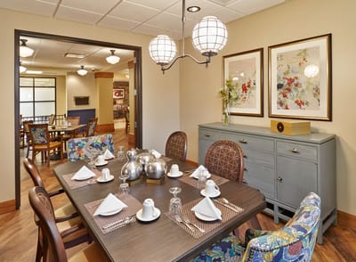 Dining room setup with elegant table settings.