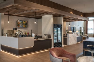 Modern interior common area with seating and amenities.