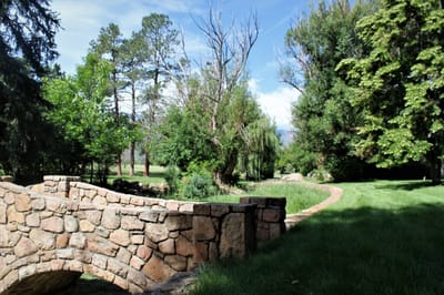 Peaceful garden area with a stone bridge