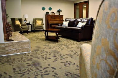 Common area with comfortable seating and piano