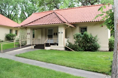Exterior view of a facility building with a garden