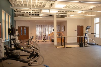 Interior view of a fitness area with exercise equipment.