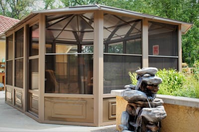 Outdoor screened area with a water feature