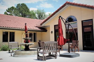Outdoor courtyard with a fountain and seating
