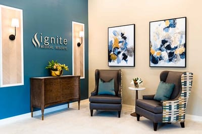 Stylish interior lounge area with chairs and artwork.