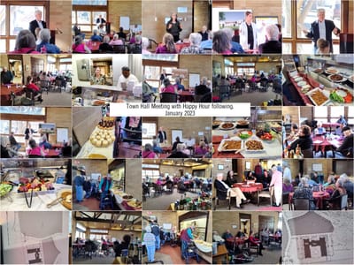 Residents enjoying a town hall meeting with food.