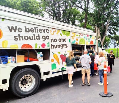 Community members engaging with a food truck.