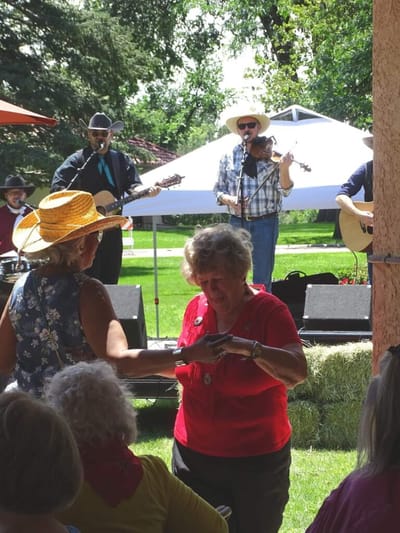 Residents enjoying live music at an outdoor event.