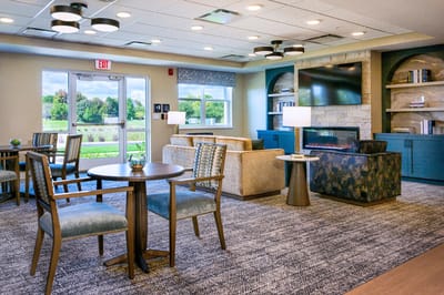 Bright common area with seating and natural light.
