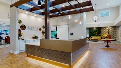 Modern reception area with seating and floral decor