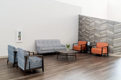 Modern common area with seating and decor.