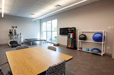 Interior therapy room with exercise equipment