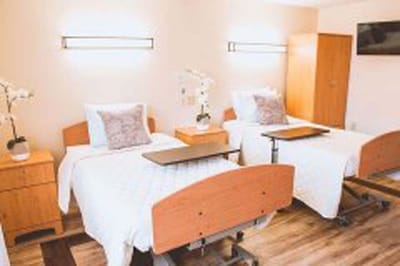 Cozy shared room with two beds and decor.