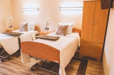 Well-furnished shared resident room with two beds