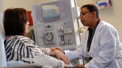 Medical staff consulting with a patient