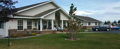 Exterior view of the facility with residents outside