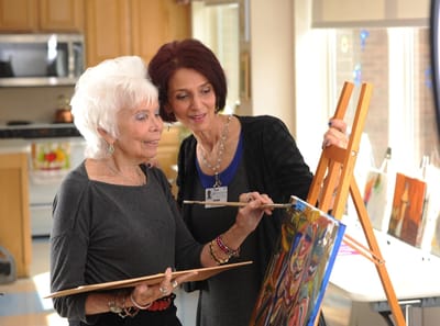 Residents and staff engaging in an art activity