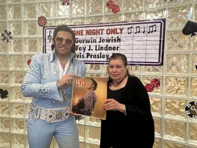 Residents enjoying an Elvis-themed event.