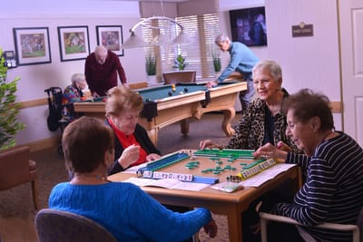Residents enjoying games in a common area.