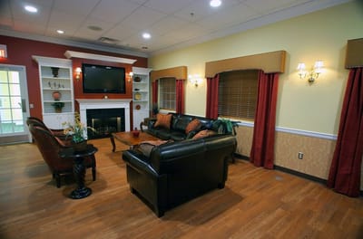 Cozy common area with seating and fireplace.