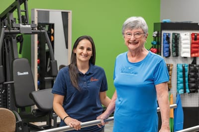 Staff member and resident in a fitness area