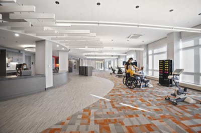 Interior common area with residents participating in activities