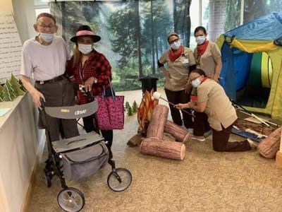 Residents and staff participating in an indoor activity.