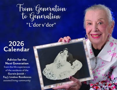 Resident holding a wedding photo for a calendar.