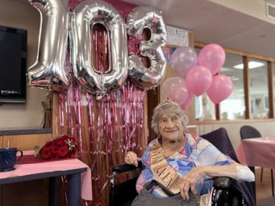 Resident celebrating 103rd birthday with decorations