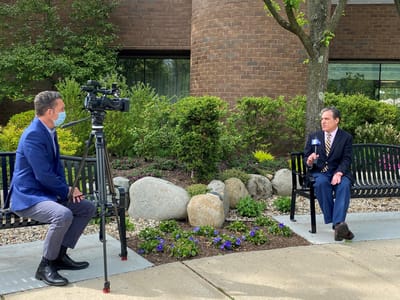 Outdoor interview setting at the facility.