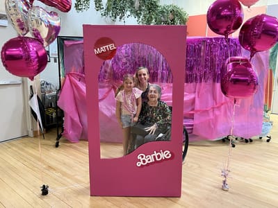 Residents celebrating with Barbie-themed decorations.