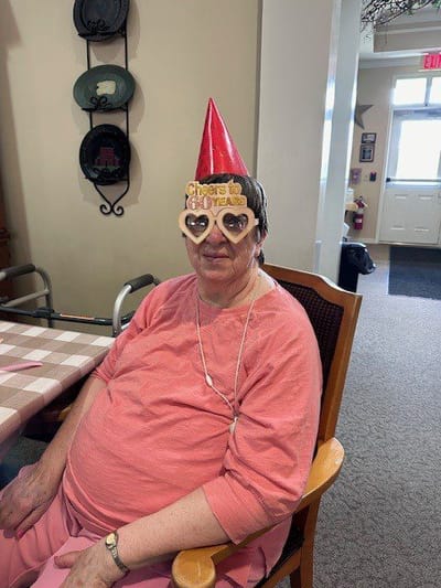 Resident celebrating with festive accessories