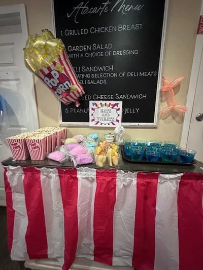 Colorful food display with popcorn and snacks