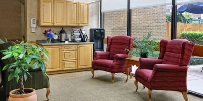 Comfortable seating area with kitchen amenities