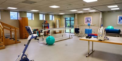 Physical therapy room with exercise equipment