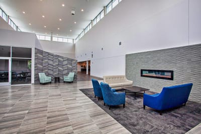 Modern common area with seating and fireplace