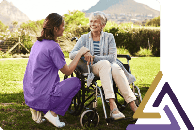 Healthcare worker interacting with a resident outdoors