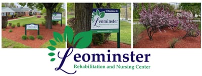 Facility's outdoor signage with flowers and landscaping.