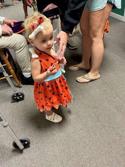 Child in a playful costume at a facility event