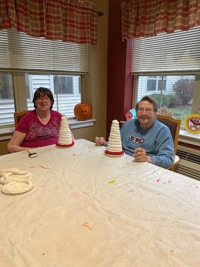 Residents engaged in a crafting activity together.